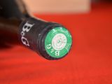 a close up of a bottle of beer on a table
