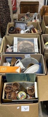 many boxes of assorted items sitting on the floor