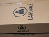 a cardboard box with a logo on it sitting on a table