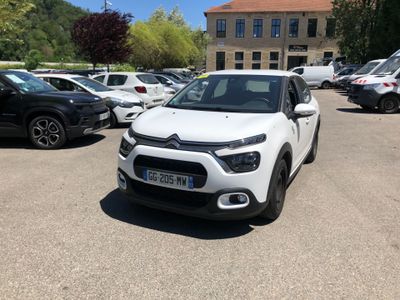 the white citrole is parked in a parking lot with other cars