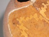 a close up of a vase with a design on it