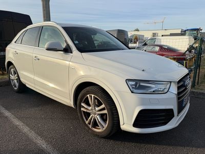 the white audi suv is parked in the parking lot
