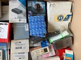 a cardboard box full of electronic equipment and other items