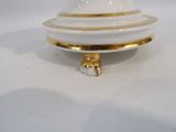 a white and gold plate with a gold trim around it