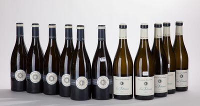 six bottles of wine are lined up in a row on a table