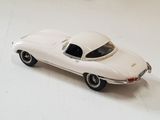 a toy car that is sitting on a white surface