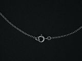 a close up of a silver chain with a clasp on a black background