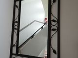a mirror hanging on the wall in a room