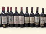 several bottles of wine are lined up in a row