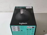 a black box with a white logo on it sitting on a counter