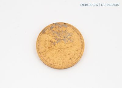 an image of a gold coin sitting on top of a white surface