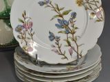 many plates stacked on top of each other on a table