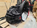a picture of a large black gear on a pallet