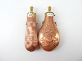 pair of antique copper salt and pepper shakers on a white background