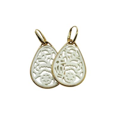 a pair of gold earrings with a white tear shaped design