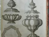 un vieux livre sur lequel figure un dessin représentant trois vases