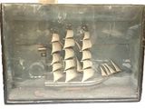 a picture of a ship in a glass case