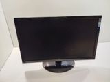 a computer monitor sitting on top of a white table