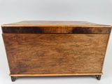 an old wooden box with a lid on a white background