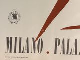 a sign that says milano palace on the side of a building