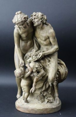 une image représentant une statue de deux hommes et d'un chien