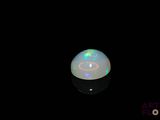 an image of a white oplite in the dark