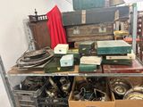 a lot of boxes and other items on a shelf