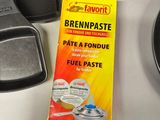 a box of bread paste next to a pan and a pancake pan