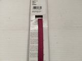 a red ribbon that is in a package on a table
