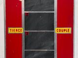 an image of a red and yellow sign with a horse and rider on it
