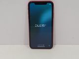 the back of a red iphone x sitting on top of a white table
