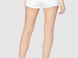 a woman wearing white shorts and a striped top
