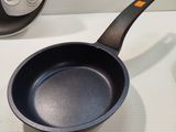 a frying pan and a frying pan on a counter