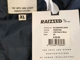 the label on the back of a jacket is attached to the back of the jacket