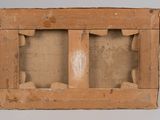 an old wooden box with two pieces of wood sticking out of it