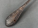 a spoon that is sitting on top of a table