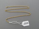a close up of a gold chain with a price tag on it