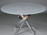 an image of a glass table with a magazine rack underneath it
