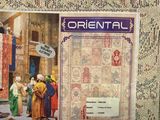 a picture of oriental rugs on display on a table