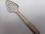 a spoon that has a spoon on it on a table