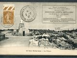 an old postcard with a picture of a road and a building