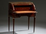 an antique writing desk with a wooden top and two drawers