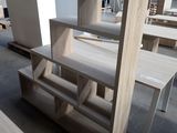a wooden table and a shelf in a warehouse