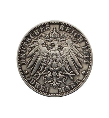 Gros plan sur une pièce d'argent ornée d'un aigle
