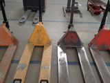 a lot of different types of pallets in a warehouse