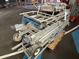 a large pile of pallets sitting in a warehouse
