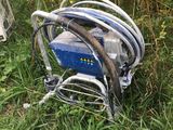 a pile of wires and wires on the ground in the grass