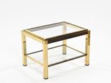 a glass and brass coffee table with a glass top