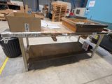 a table that is sitting in the middle of a warehouse