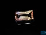 an emerald stone in the dark with a black background